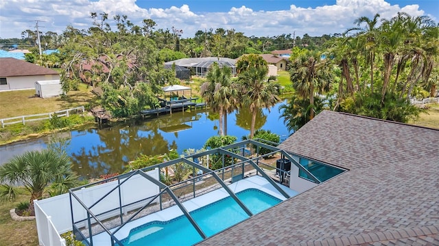 view of swimming pool featuring a water view