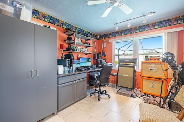 tiled home office with a textured ceiling, ceiling fan, and track lighting