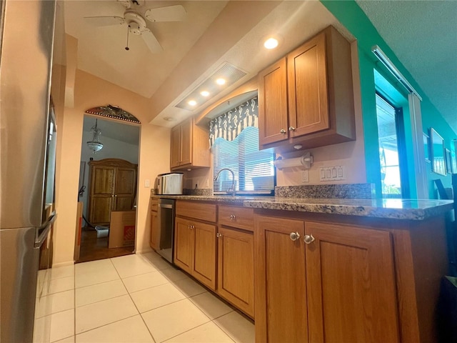 kitchen with ceiling fan, stainless steel appliances, a wealth of natural light, and sink