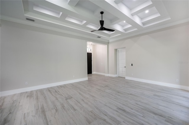 empty room featuring light hardwood / wood-style floors, coffered ceiling, ceiling fan, and crown molding