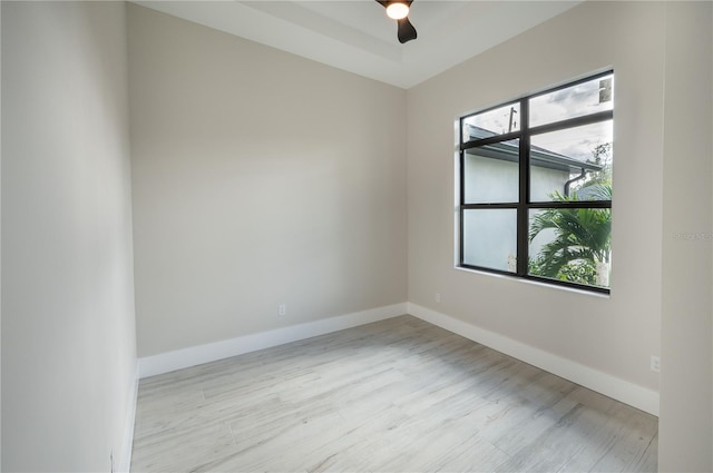 spare room with ceiling fan and light hardwood / wood-style flooring