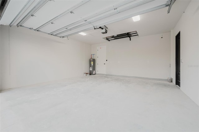 garage with a garage door opener and electric water heater