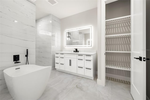 bathroom featuring vanity and a bathtub