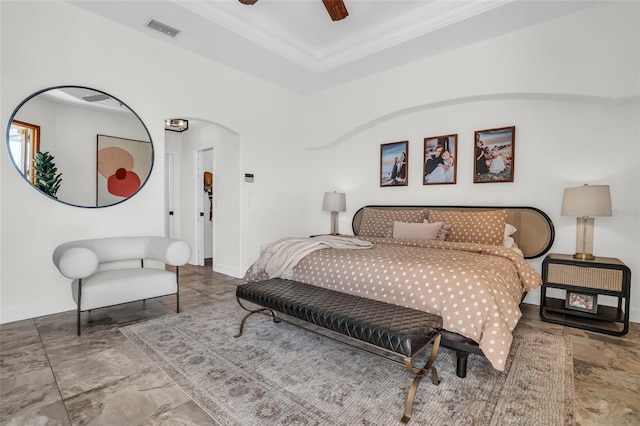 bedroom with ceiling fan and ornamental molding