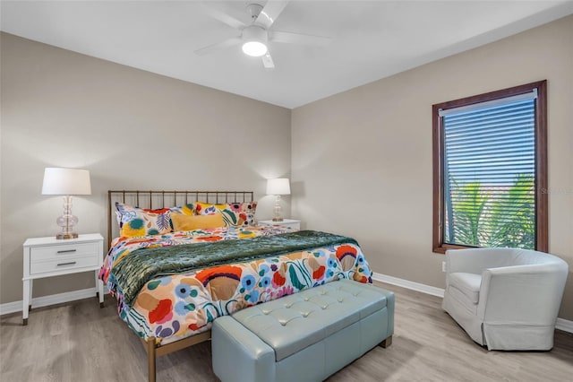 bedroom with light wood-type flooring and ceiling fan