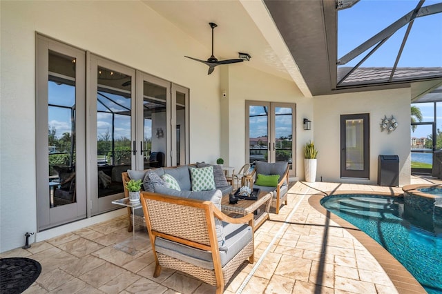 view of patio / terrace featuring french doors, outdoor lounge area, ceiling fan, a swimming pool with hot tub, and glass enclosure