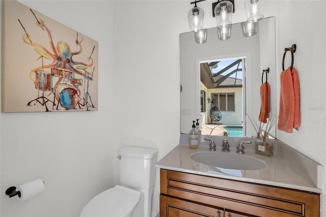 bathroom featuring vanity and toilet