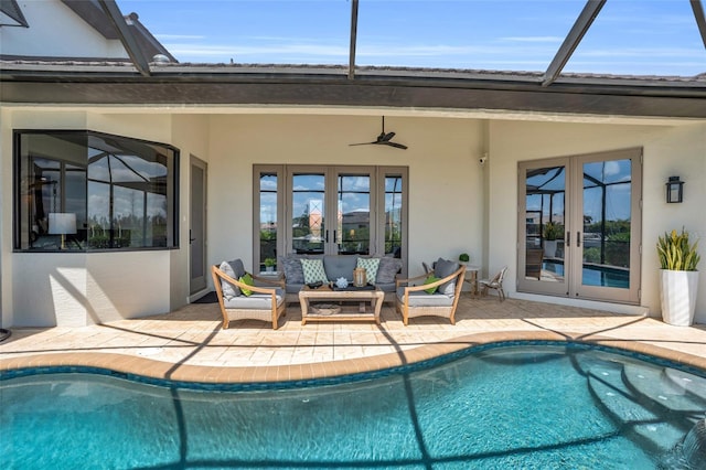 view of swimming pool with outdoor lounge area, french doors, a patio, and ceiling fan