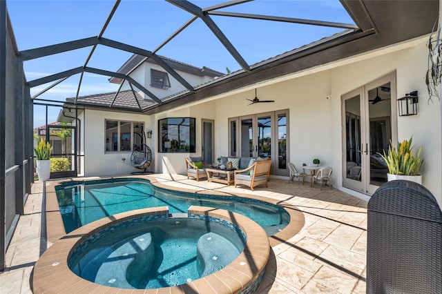 view of swimming pool featuring an in ground hot tub, french doors, a patio, and ceiling fan