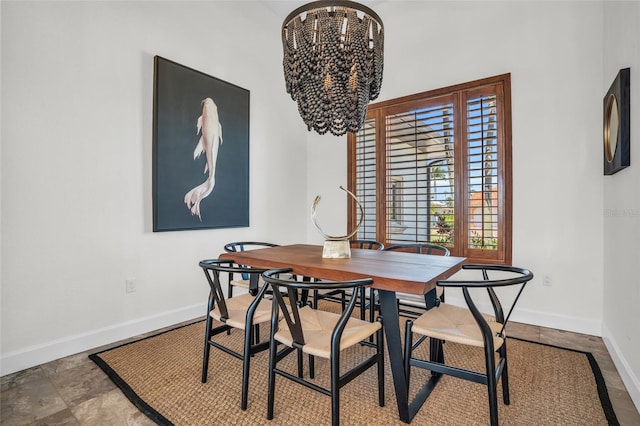 dining area featuring a notable chandelier