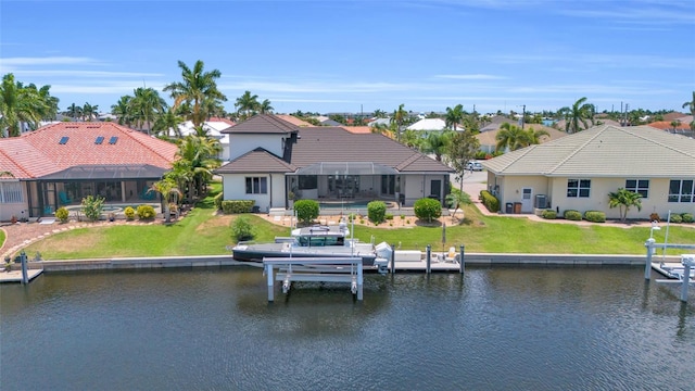 dock area featuring glass enclosure and a water view