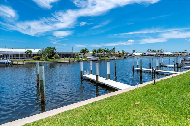 view of dock featuring a yard and a water view