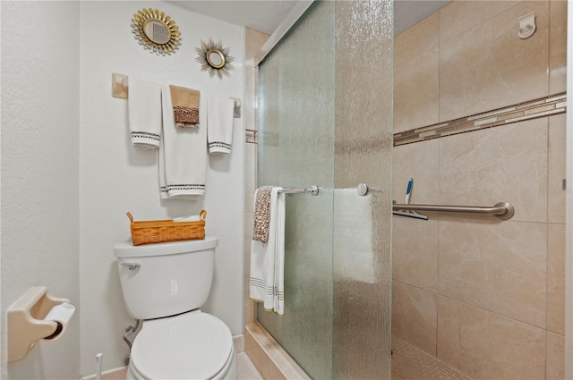 bathroom with toilet and walk in shower