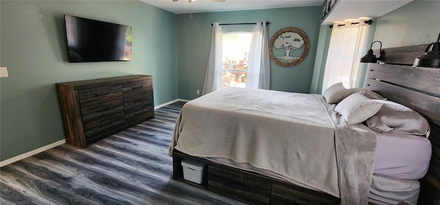 bedroom with dark hardwood / wood-style floors