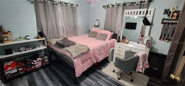 bedroom featuring dark hardwood / wood-style floors