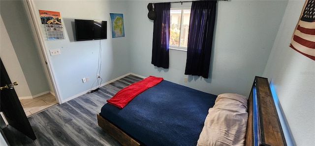 bedroom featuring dark hardwood / wood-style floors