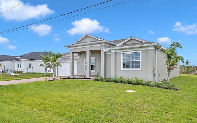 view of front of house featuring a garage and a front lawn