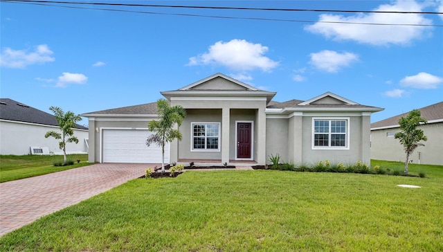 view of front of home featuring a garage and a front yard