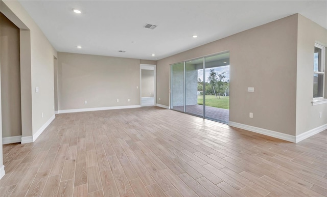 spare room with light wood-type flooring