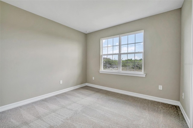 unfurnished room featuring carpet flooring