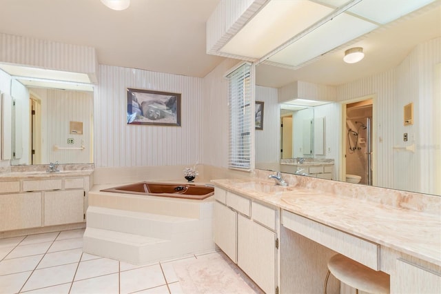 bathroom featuring tile patterned floors, a sink, toilet, and wallpapered walls