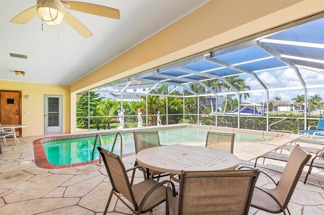 pool with a lanai and a patio