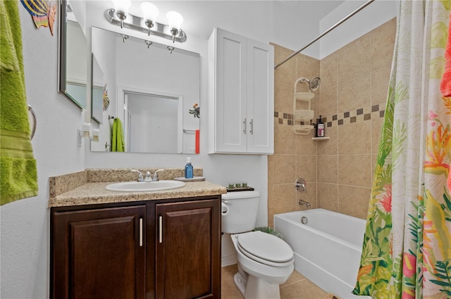 full bathroom featuring tile floors, vanity, toilet, and shower / bath combo with shower curtain