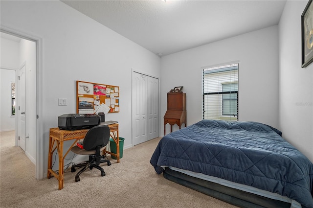 carpeted bedroom with a closet