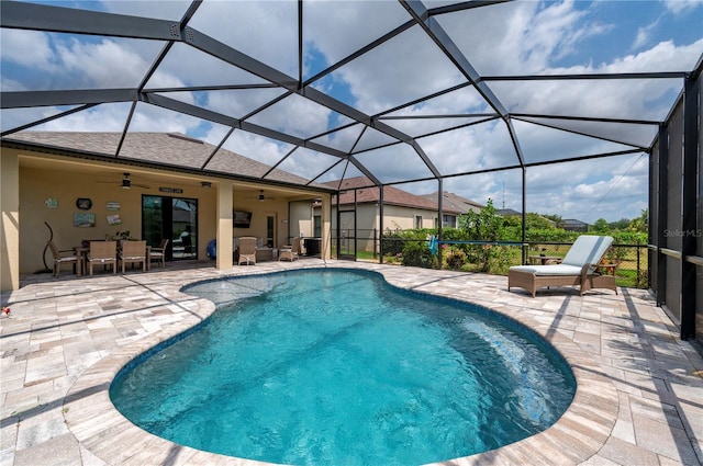 view of pool featuring a patio, a lanai, and ceiling fan