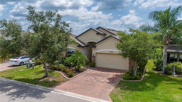 view of front of house featuring a front yard and a garage