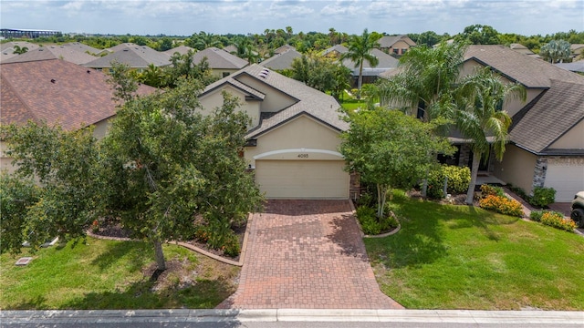 view of front facade with a garage and a front lawn