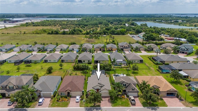 birds eye view of property with a water view