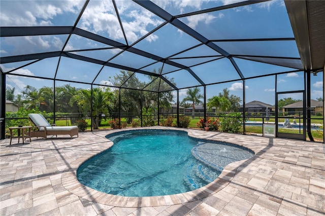 view of pool featuring a lanai and a patio area