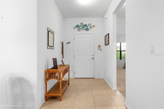 entryway featuring light tile flooring