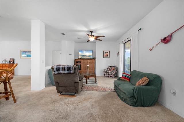 living room with ceiling fan and light colored carpet