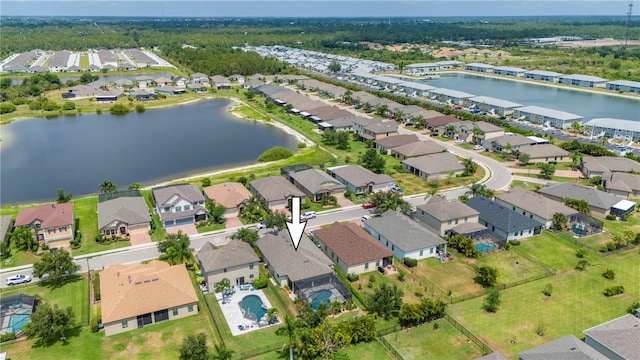 birds eye view of property with a water view