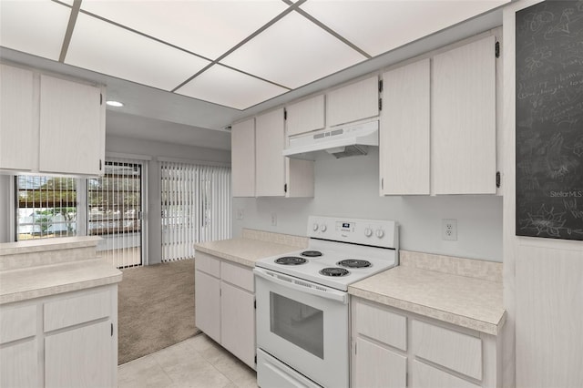 kitchen with white range with electric cooktop and light colored carpet