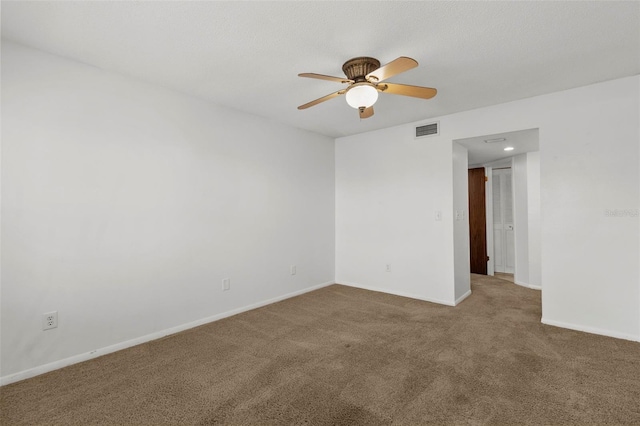 empty room with carpet and ceiling fan