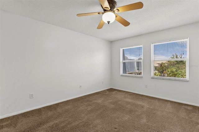 spare room with ceiling fan and carpet floors