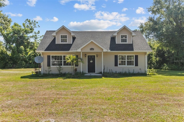 cape cod-style house with a front lawn