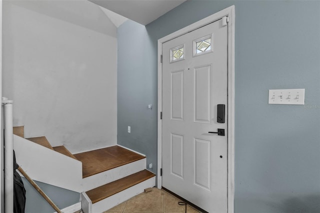 foyer entrance featuring light tile patterned flooring