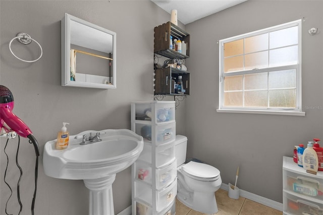 bathroom featuring tile patterned flooring and toilet