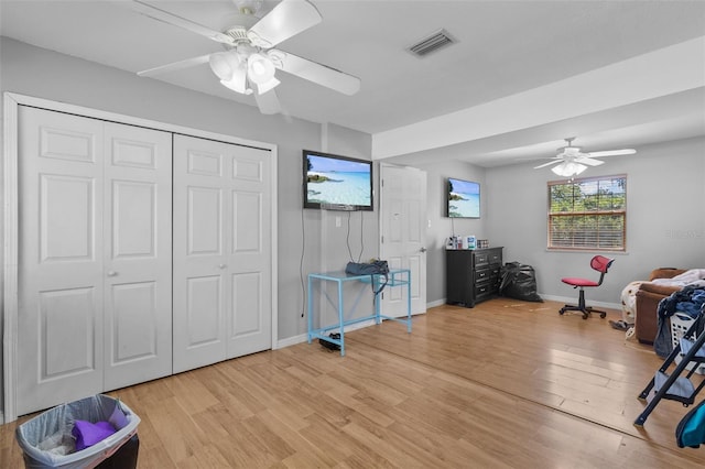 interior space featuring ceiling fan and light wood-type flooring