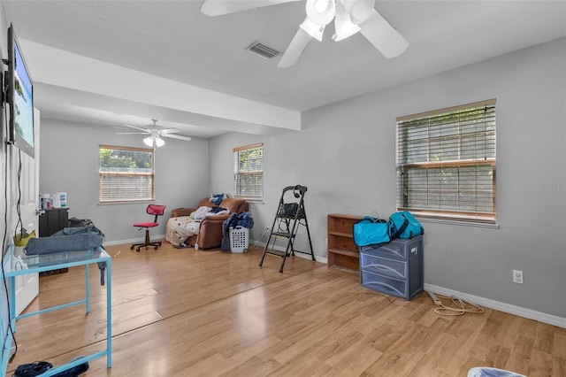 miscellaneous room featuring ceiling fan and light hardwood / wood-style flooring