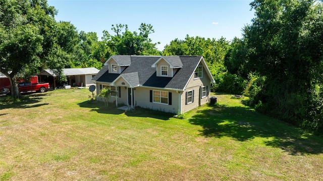 cape cod house featuring a front yard and covered porch