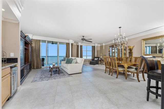 dining room with ceiling fan with notable chandelier, light tile patterned flooring, ornamental molding, and wine cooler