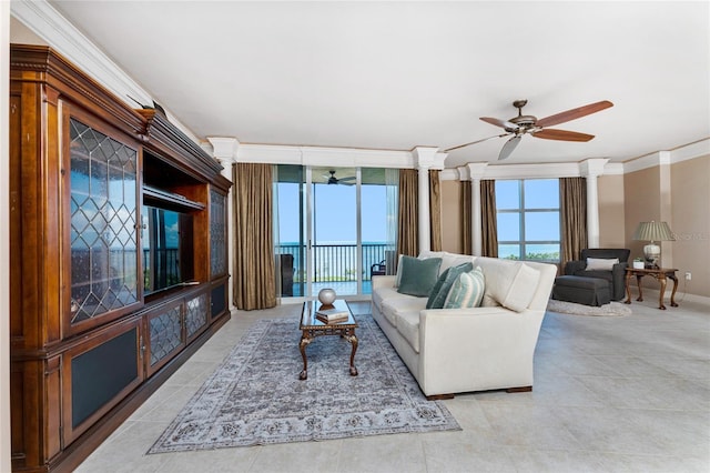 living room with floor to ceiling windows, ceiling fan, and ornamental molding