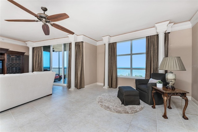 living room featuring ornamental molding, ceiling fan, and a water view