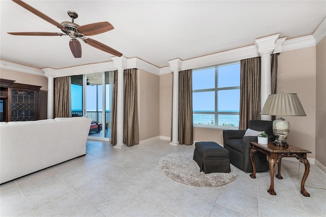 3333 Sunset Key Cir Unit 506, Punta Gorda, FL 33955 - living room with crown molding, decorative columns, baseboards, a ceiling fan, and light tile patterned floors