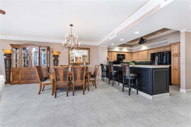 3333 Sunset Key Cir Unit 506, Punta Gorda, FL 33955 - dining area featuring ornamental molding, a chandelier, a tray ceiling, light tile patterned floors, and recessed lighting